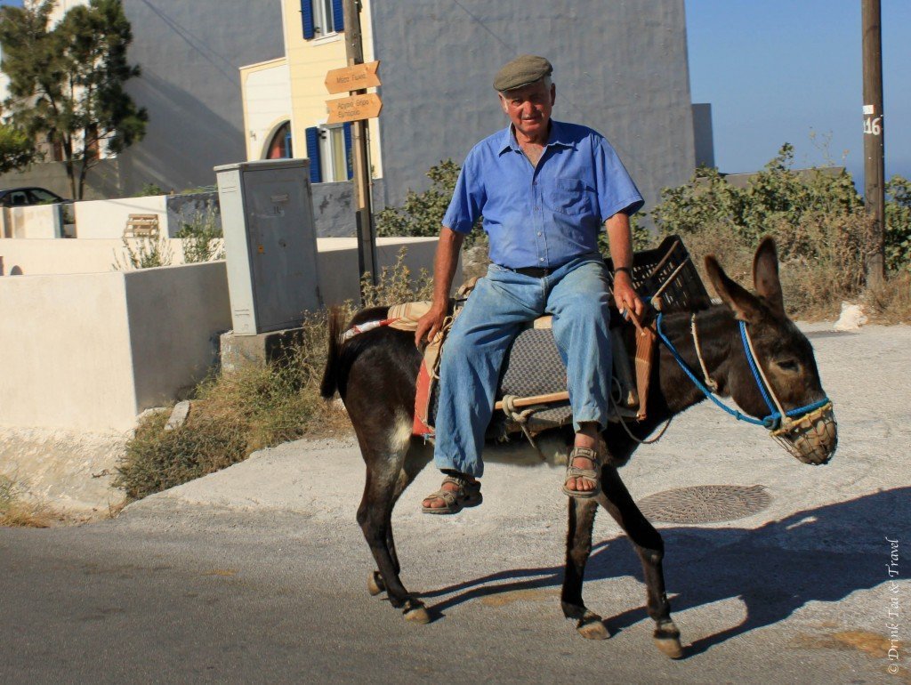 Riding a donkey in Santorini in Greece